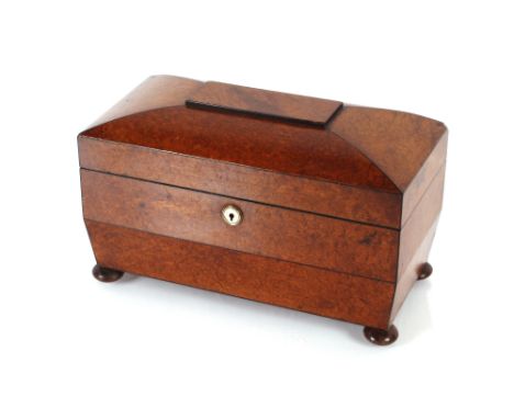 A burr wood sarcophagus shaped tea caddy, fitted two hinged compartments and glass mixing bowl, 33cm&nbsp;