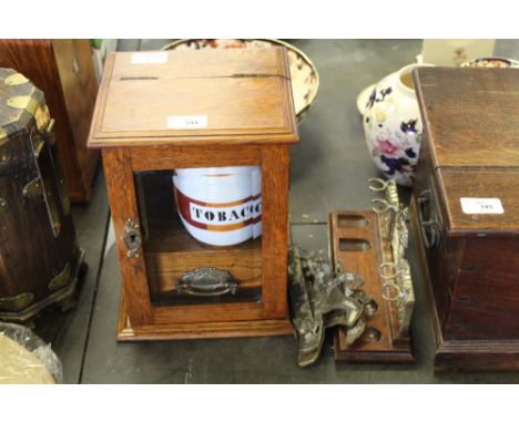 Oak glazed smoker's cabinet, pipe rack & 2 brass ornaments