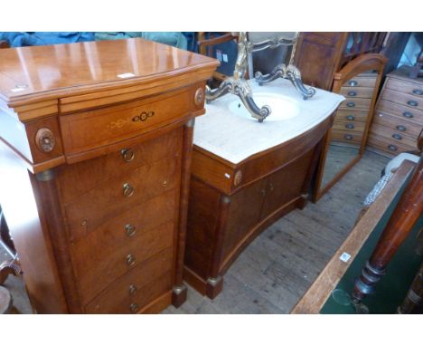 A 20th Century Continental pedestal chest of concave form with seven drawers and pillared side supports, together with a matc