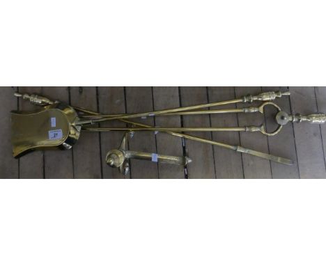 A set of brass fire tools 