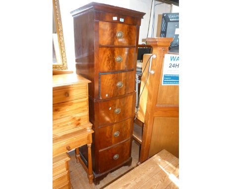 A Victorian flame mahogany tall and narrow bowfront chest on chest, having six drawers, each with brass Prince of Wales feath