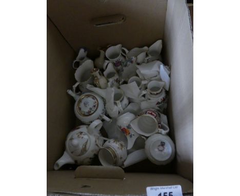 A collection of modern Royal Worcester miniature jugs, teapots plus other further ceramics 