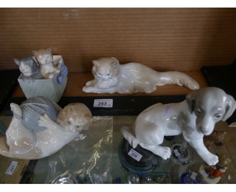 A collection of four Nao models of cats and a dog