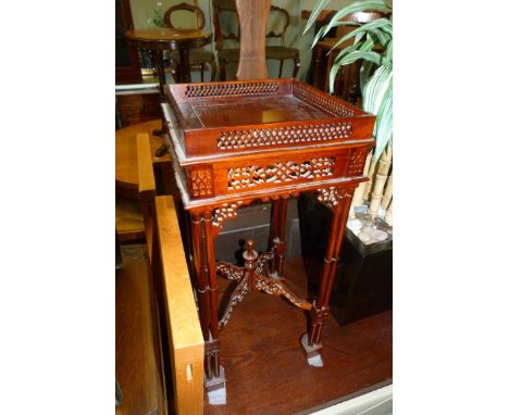 A 20th Century mahogany lamp table, together with reproduction mahogany oval topped wine table, together with a similar leath