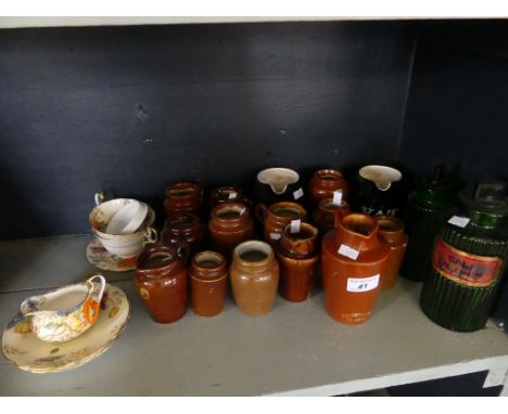 A mixed lot comprising various unbranded stoneware cream jugs and pots, chemists rounds, Wade whisky jugs and a quantity of A