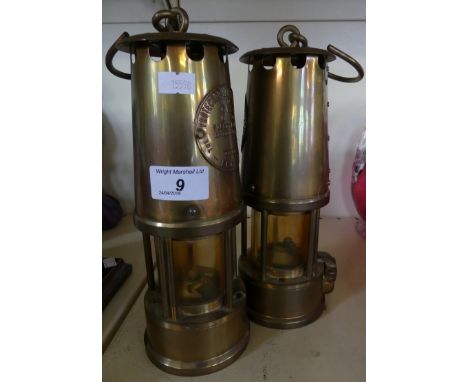 Two miners lamps, marked The Protector Lamp & Lighting Co, Eccles.