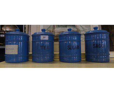 A set of four vintage blue enamel kitchen storage jars 
