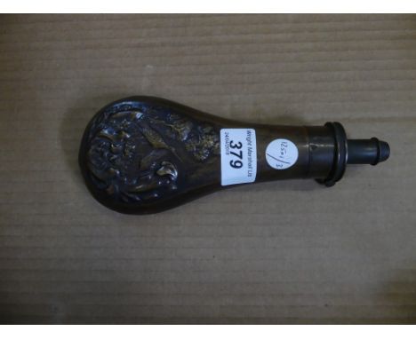 A 10th Century pressed copper shot/powder flask decorated with birds and foliage 
