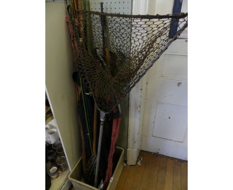 A mixed lot of various fishing rods, fishing landing nets, Lacross stick and various other items 