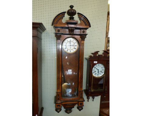 A late 19th/early 20th Century Vienna regulator wall clock in walnut and ebonised case with break arched pediment