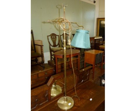 A modern brass adjustable floor standing lamp 