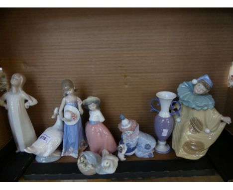 A collection of Lladro and Nao figures and a further Lladro vase (8)