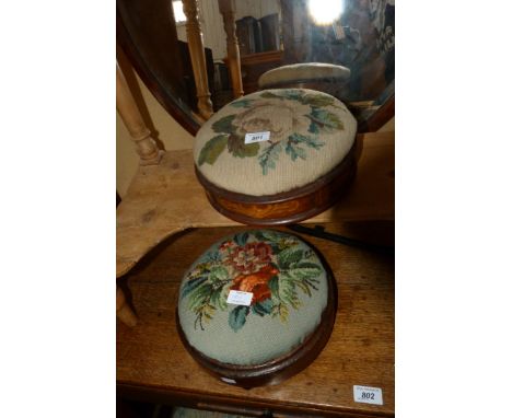 Two Victorian circular footstools with tapestry tops 