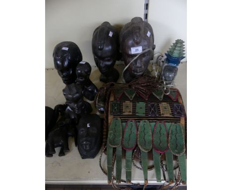 A collection of various West African carved hardwood busts and figures, together with a further Ethnic bag and a small elepha