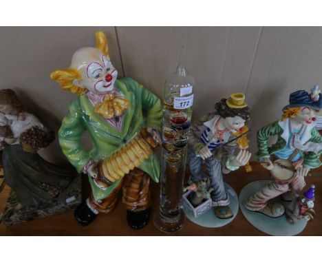 A mixed lot comprising three modern models of clowns together with a modern composition figure on marble base and a Galileo t