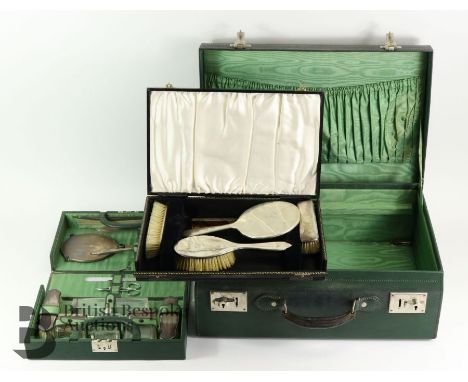 An Edward VIII lady's travelling vanity case, the green leather case opens to reveal a fitted folding tray complete with acce