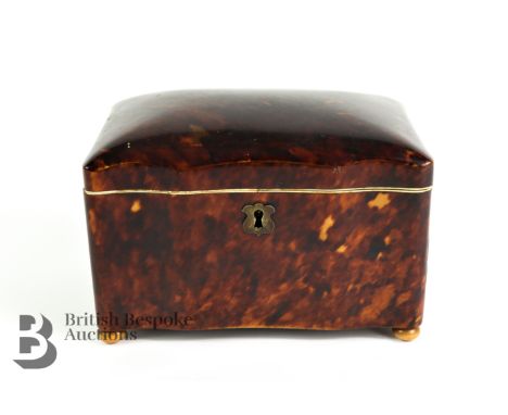 19th century tortoise shell tea caddy, with domed hinged lid, opening to reveal two compartments with tortoiseshell covers wi