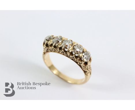 Late Victorian 14ct five stone diamond ring. The ring set with  pts of graduated old-cut dias, claw set on a pierced arabesqu