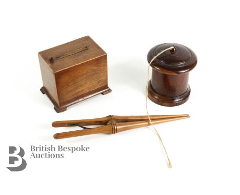 19th century Lignum vitae string barrel, approx 13 cms h; mahogany tabletop dispenser with push button approx 9 x 10.5 x 13 c