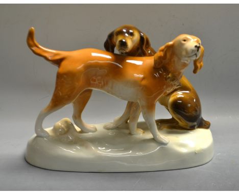 A Royal Dux model of two hunting dogs, gloss finish, triangle mark to base