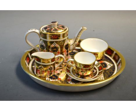 A Royal Crown Derby 1128 miniature tea service on tray