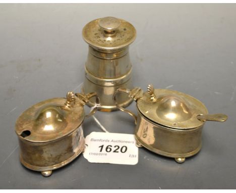 A George VI silver coopered pepper grinder, 5cm high, Sheffield 1938; a pair of Edwardian tankard mustards, domed covers, bal