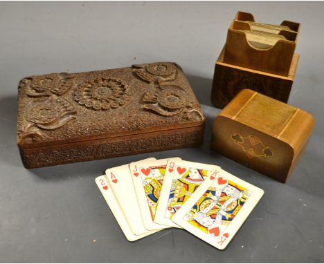 An Italian style mahogany marquetry effect rounded rectangular playing card box and cover, 12cm high; an Anglo-Indian cigaret