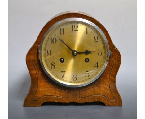 A 20th century oak cased chiming mantel clock