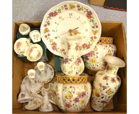 A pair of Zsolnay Porcelain cachepots, hand painted with flowers and butterflies, reticulated necks; conforming baluster vase