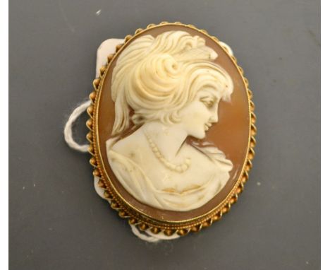 A Neoclassical Cameo portrait brooch, as a maiden, 9ct gold frame