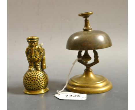 Golfing Interest - a cast brass table bell, as the ' Dunlop 31 ' golf caddy standing upon a golf ball bell bowl, 9cm high;  a