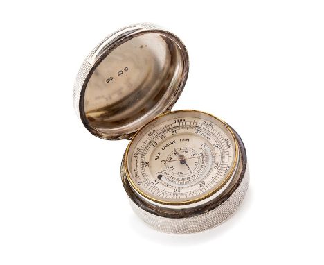 A George V circular cased portable desk barometer, with engine turned sides, plain thumbpiece, cover and base, by Alfred Clar