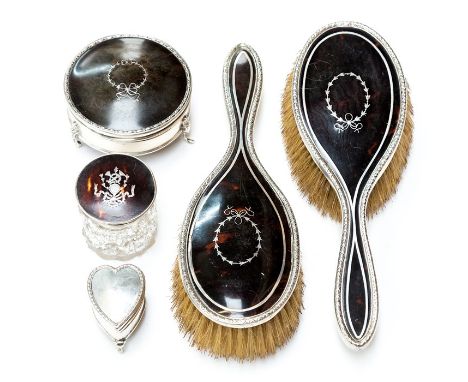 A&nbsp;collection of early 20th Century tortoiseshell and silver mounted dressing table items&nbsp;including a pair of hairbr