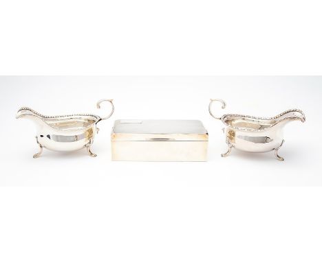 A pair of Edward VIII plain oval sauceboats, egg-and-dart border on three paw feet,&nbsp;Cooper Brothers &amp; Sons Ltd, Shef