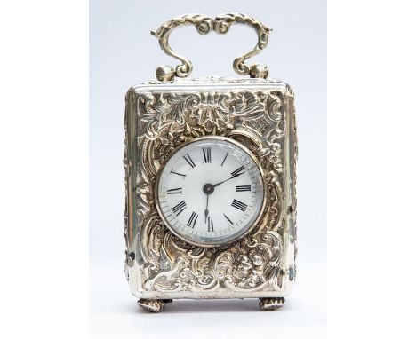 A Victorian silver cased carriage clock, the circular enamel dial with Roman numerals, within a repousse surround foliate, sc