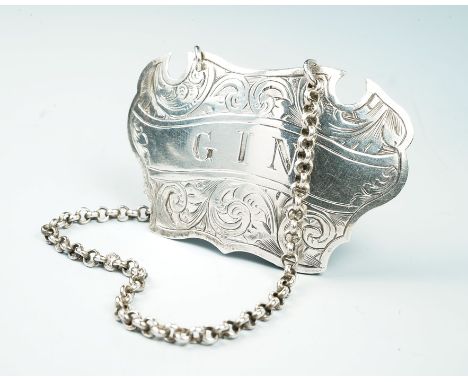 A Victorian silver shaped cartouche Gin decanter label, with engraved decoration,&nbsp;by Hilliard &amp; Thomason, Birmingham