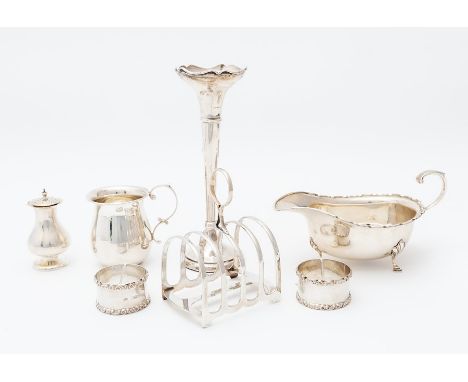 A collection of silver tableware including: a George VI oval sauceboat, on three hoof and shell feet, C-scroll handle, A Bros