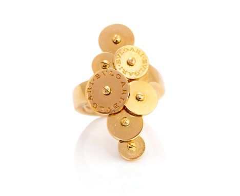 A Bvlgari yellow gold designer Cicladi signet ring, the head comprising seven rotating yellow gold discs with screw head cent