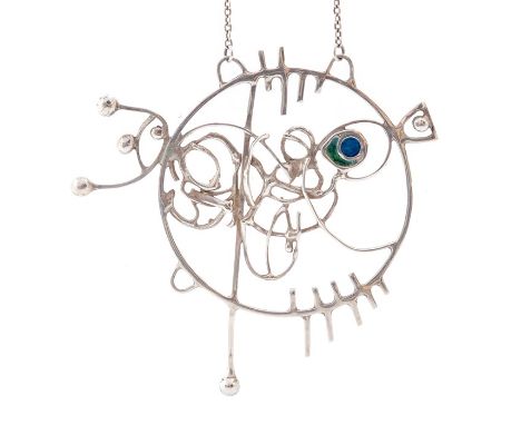 Norman Grant- A Modernist circa 1970's silver pendant in the form of a fish, open wire work design with green and blue enamel