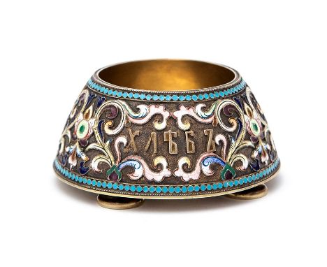 An early 20th Century Russian silver-gilt and cloisonné enamel large salt, with scrolling foliage body and cyllic letter &amp