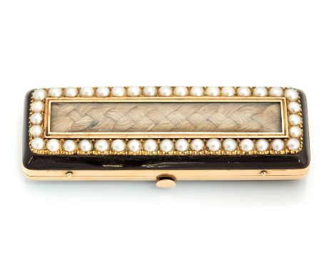 A 19th century black enamel mourning patch box, the hinged cover set with a plait of hair within a seed pearl surround, openi