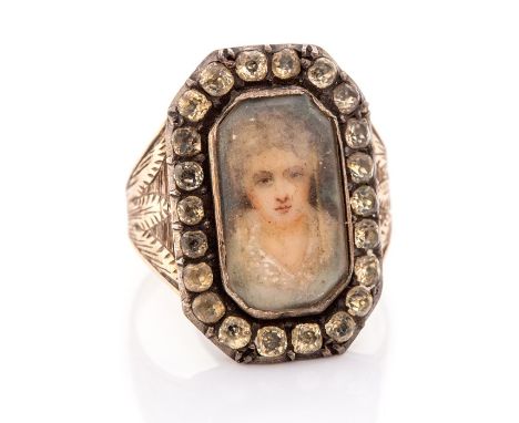 A late 18th/early 19th century gold and silver sentimental ring, set with a glazed compartment with a portrait miniature with