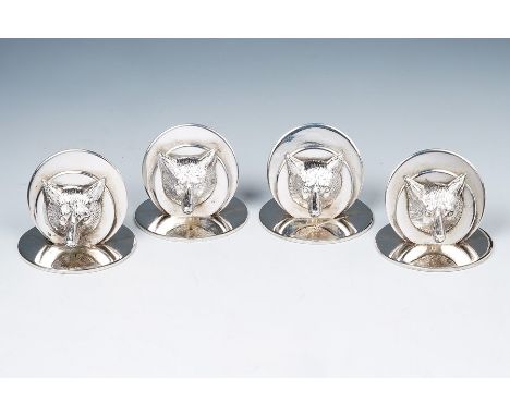 Hunting Interest: A set of four Edwardian silver large menu holders, each cast with a foxes mask on circular bases, hallmarke