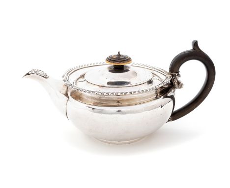 A George III (Regency) silver melon shaped teapot, plain body with gadroon border, C-scroll fruitwood handle, the hinged cove