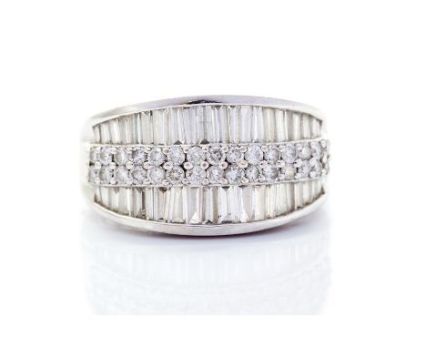 A diamond four-row half set 18ct white gold band ring, the front section comprising two central rows of small round brilliant