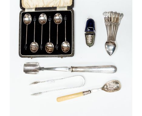 A collection of silver including: an Edwardian stilton scoop, Sheffield, 1902; a jam spoon with chased bowl, bone handle, She