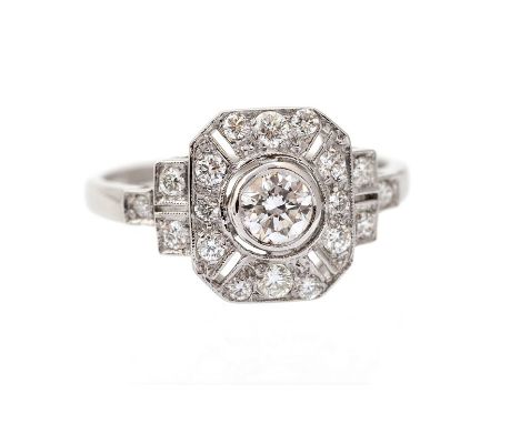 An art Deco style diamond set cluster ring, comprising central brilliant cut diamond weighing approx 0.20 ct with border of g