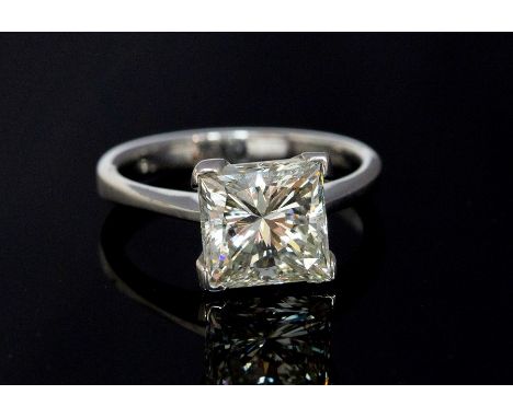 A diamond solitaire 18ct white gold ring, the princess cut diamond accompanied by and E.G.L report stating a  weight approx 2