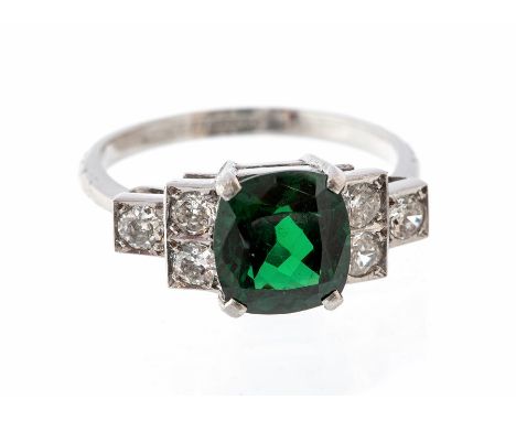 An Art Deco style tsavorite garnet and diamond ring, the cushion cut tsavorite garnet along with an accompanying Anchor cert 