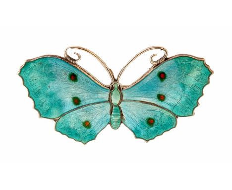 An early 20th Century silver and enamel brooch, the turquoise enamel wings  decorated with orange and green dots, size approx